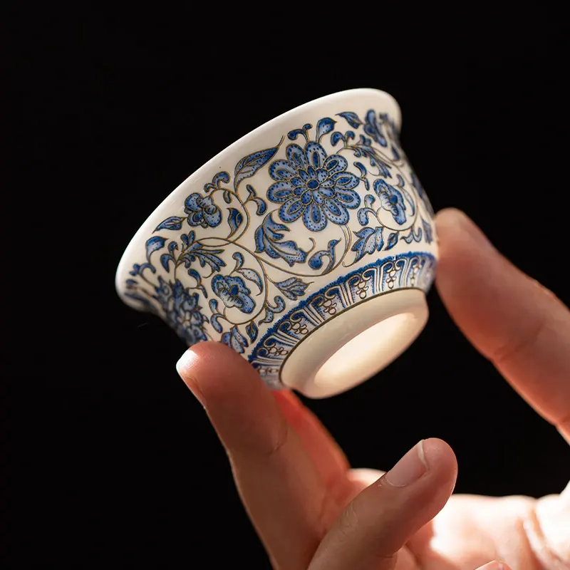 "Mutton-fat" jade-style porcelain tea cup featuring an intertwined lotus pattern—a premium "master's cup" for Gongfu tea brewing and personal use; a popular, trendy choice for tea enthusiasts.