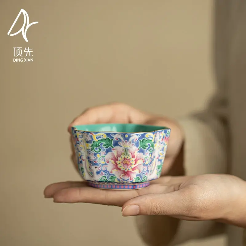 Turquoise-green enameled cup with interlocking lotus pattern—a vintage-style Chinese tea cup designed for personal use.